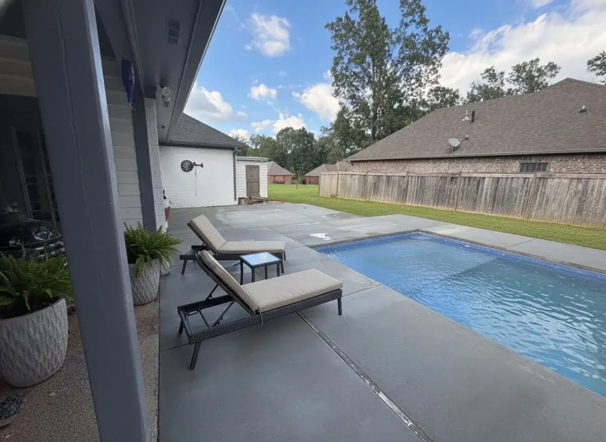 Finished Latham fiberglass pool and patio by DC Pools and Spas